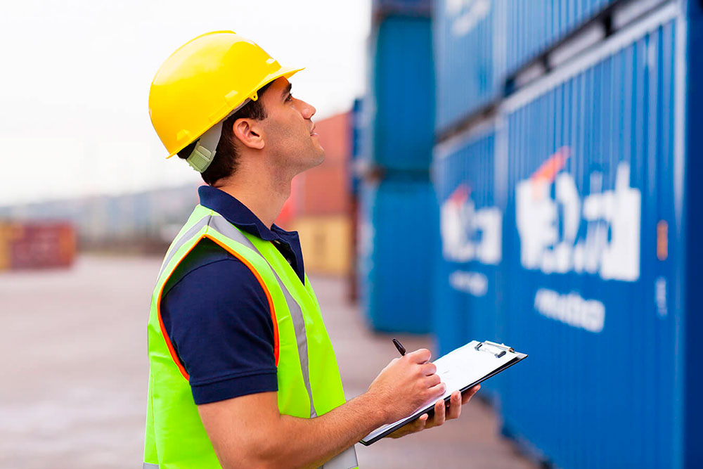 Man standing in front of container